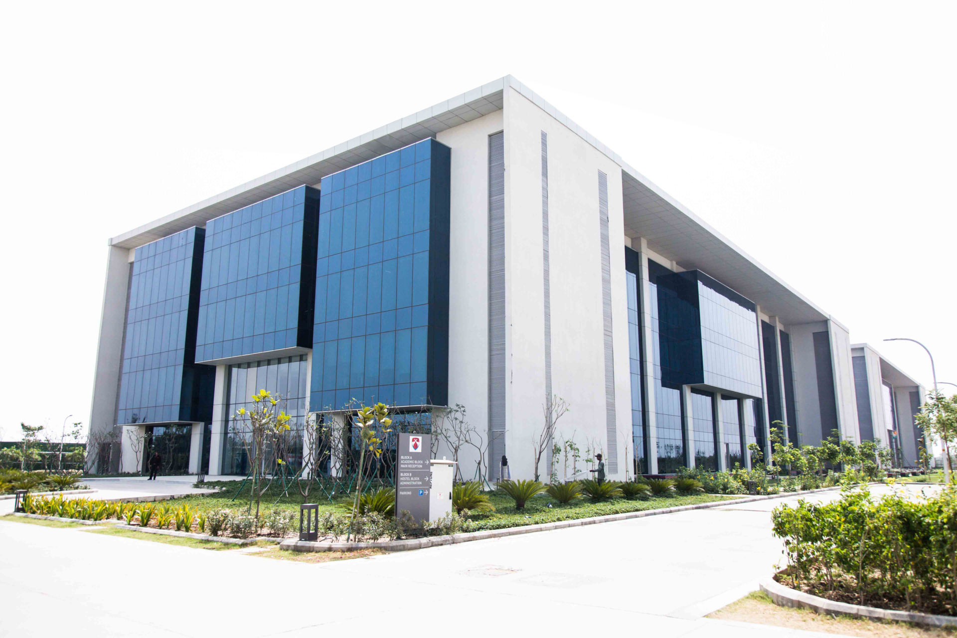 Bennett University academic building with blue glass panels and landscaped walkways